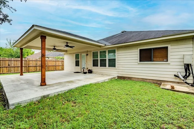 a view of a backyard with a patio