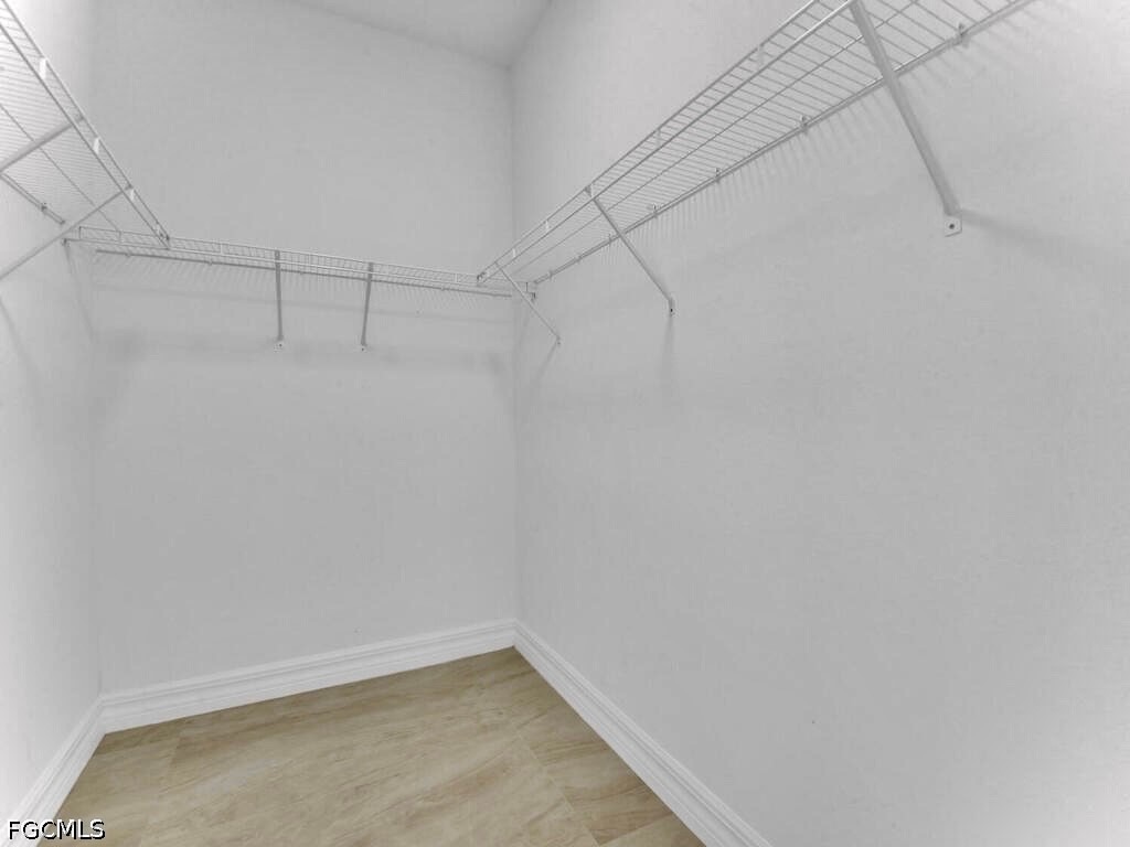 637 Cardinal Street East Lehigh Acres, FL 33974 - Photo 12 of 34 a view of a room with racks on the wall