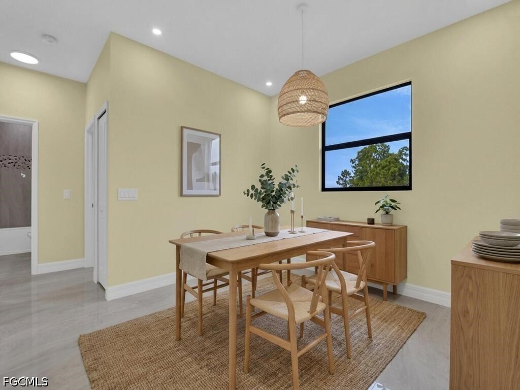 637 Cardinal Street East Lehigh Acres, FL 33974 - Photo 14 of 34 a view of a dining room with furniture