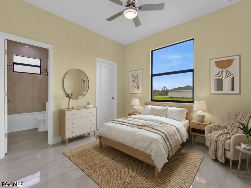 637 Cardinal Street East Lehigh Acres, FL 33974 - Photo 17 of 34 a bedroom with a large bed and a chandelier