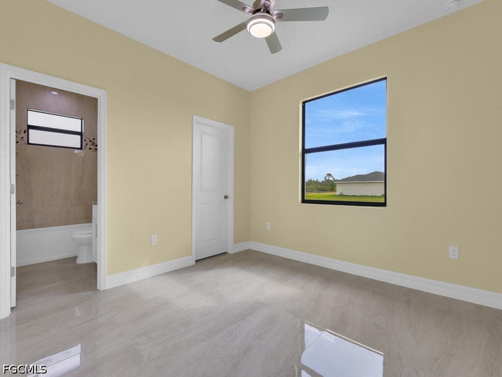 637 Cardinal Street East Lehigh Acres, FL 33974 - Photo 18 of 34 a view of an empty room with a window
