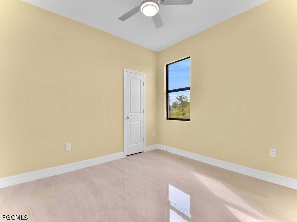 637 Cardinal Street East Lehigh Acres, FL 33974 - Photo 23 of 34 an empty room with windows