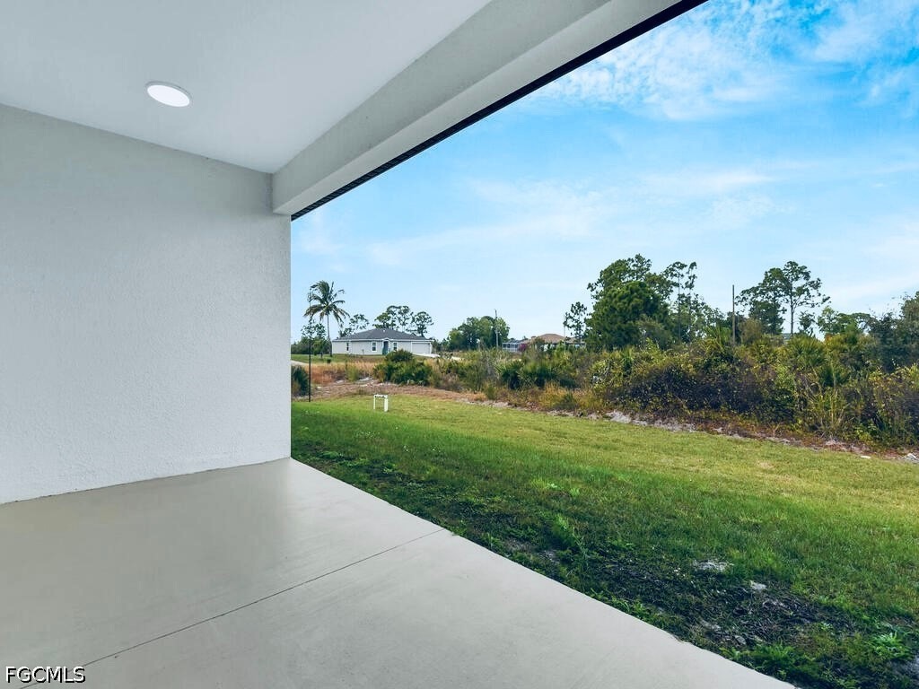 637 Cardinal Street East Lehigh Acres, FL 33974 - Photo 31 of 34 a view of a big room with wooden fence