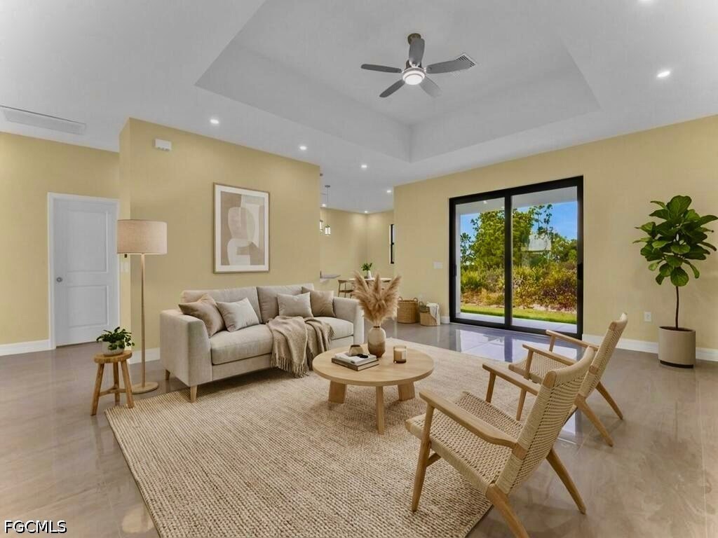 637 Cardinal Street East Lehigh Acres, FL 33974 - Photo 4 of 34 a living room with furniture and a large window
