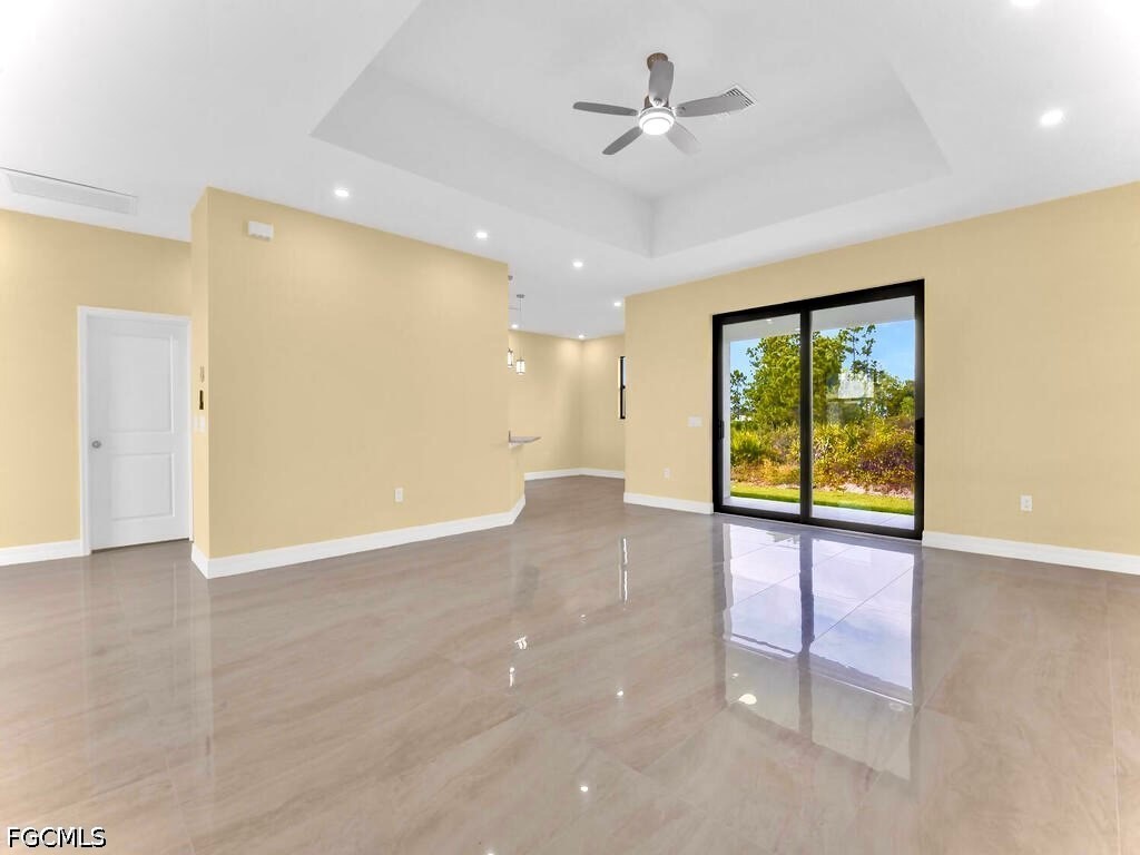 637 Cardinal Street East Lehigh Acres, FL 33974 - Photo 5 of 34 a view of an empty room with a window