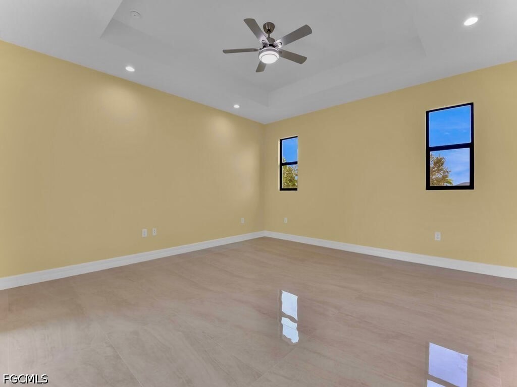 637 Cardinal Street East Lehigh Acres, FL 33974 - Photo 8 of 34 a view of an empty room with a window