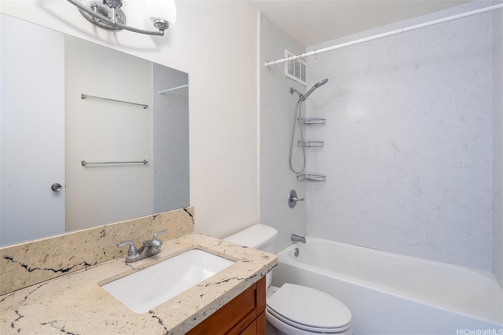 949 Ala Nanala Street, Unit 501 Honolulu, HI 96818 - Photo 12 of 18 a bathroom with a sink toilet and shower