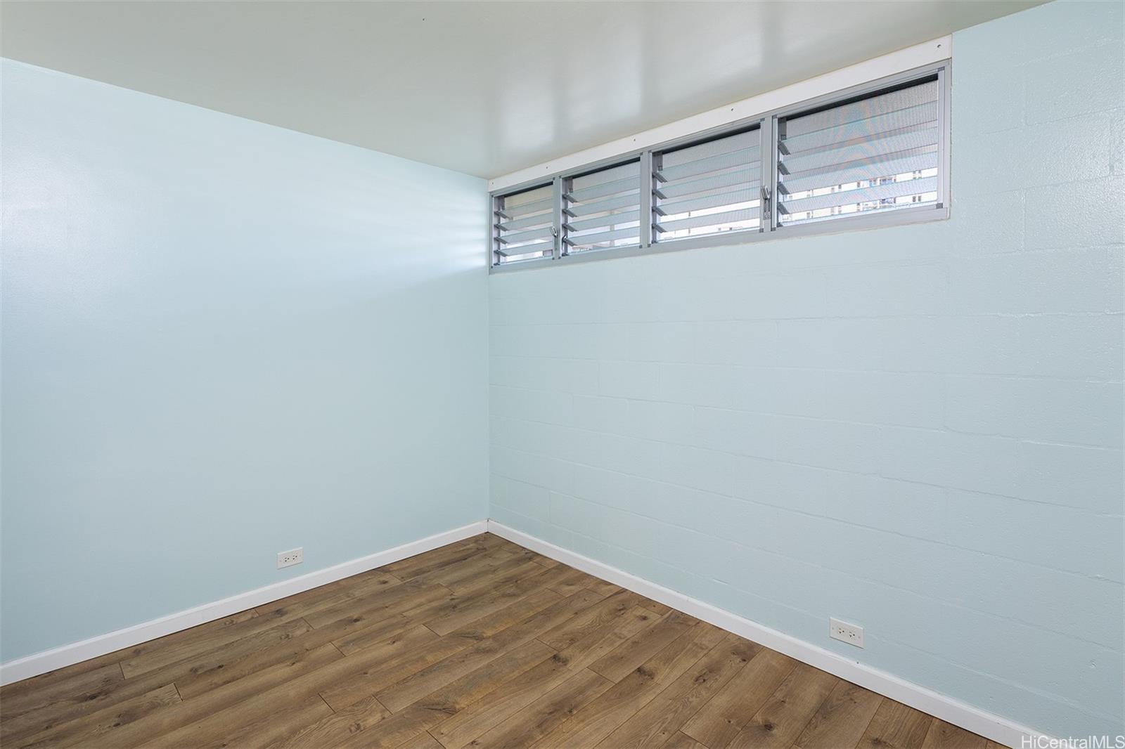 949 Ala Nanala Street, Unit 501 Honolulu, HI 96818 - Photo 10 of 18 a view of a room with wooden floor