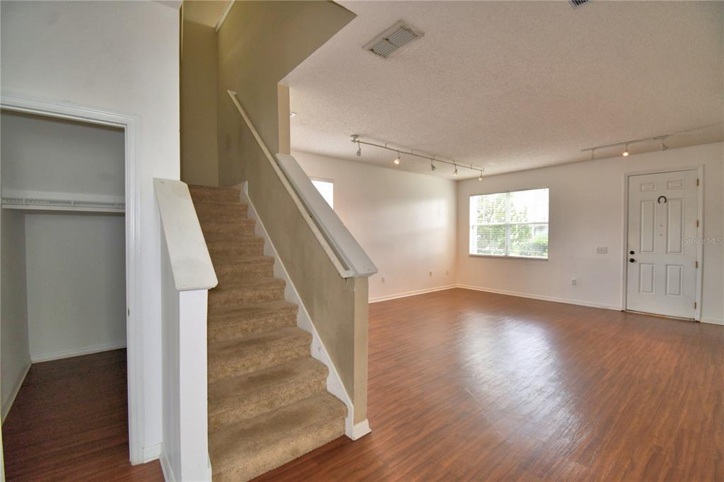 154 Canna Drive Davenport, FL 33897 - Photo 12 of 85 a view of an entryway with wooden floor