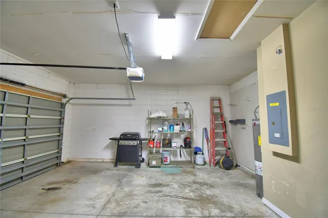 a view of a room with a ceiling fan and closet area
