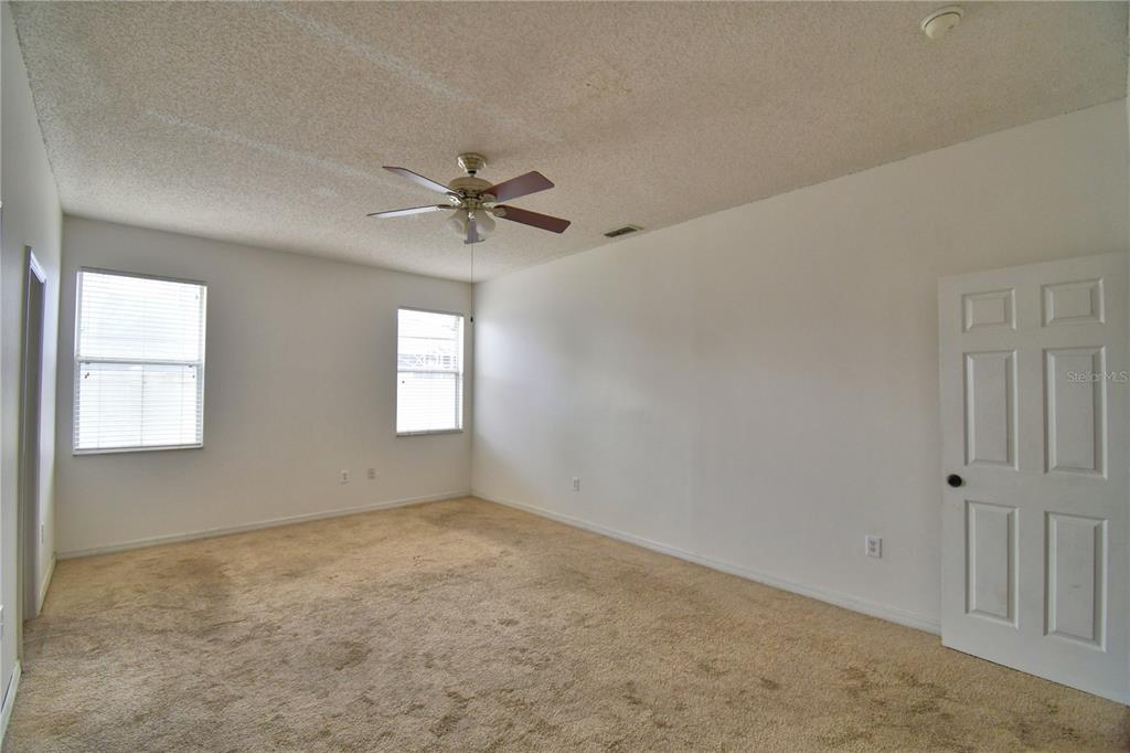 154 Canna Drive Davenport, FL 33897 - Photo 17 of 85 a view of an empty room with a window