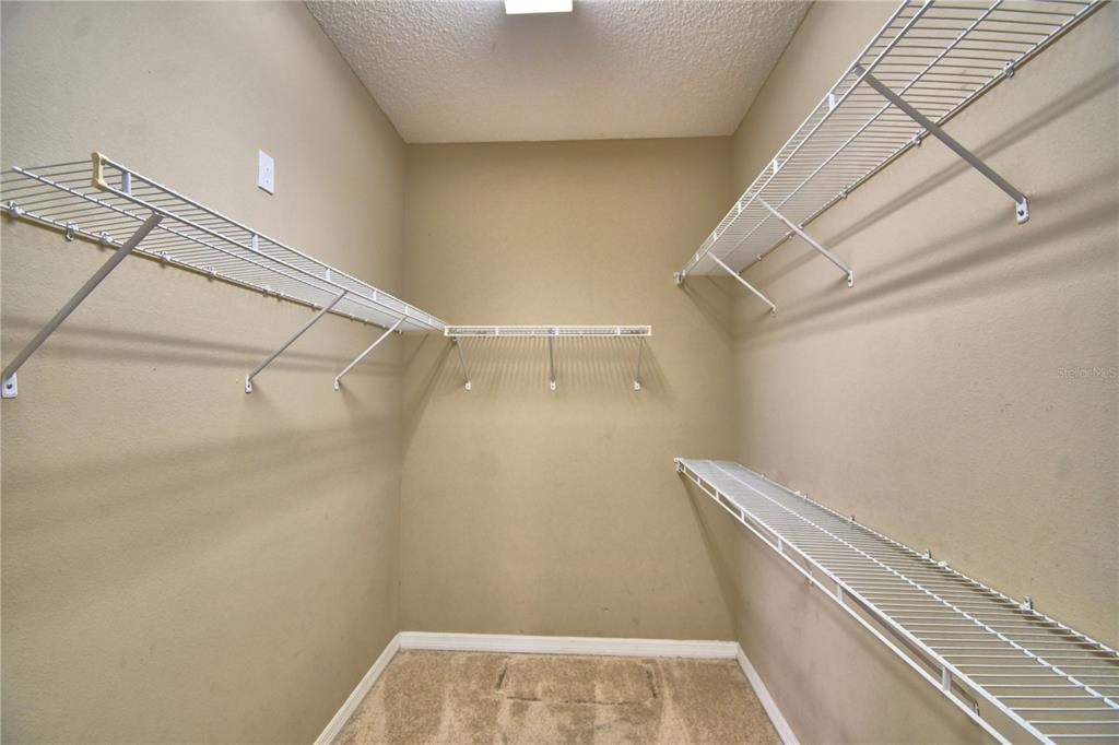 154 Canna Drive Davenport, FL 33897 - Photo 24 of 85 a view of a room with racks on the wall