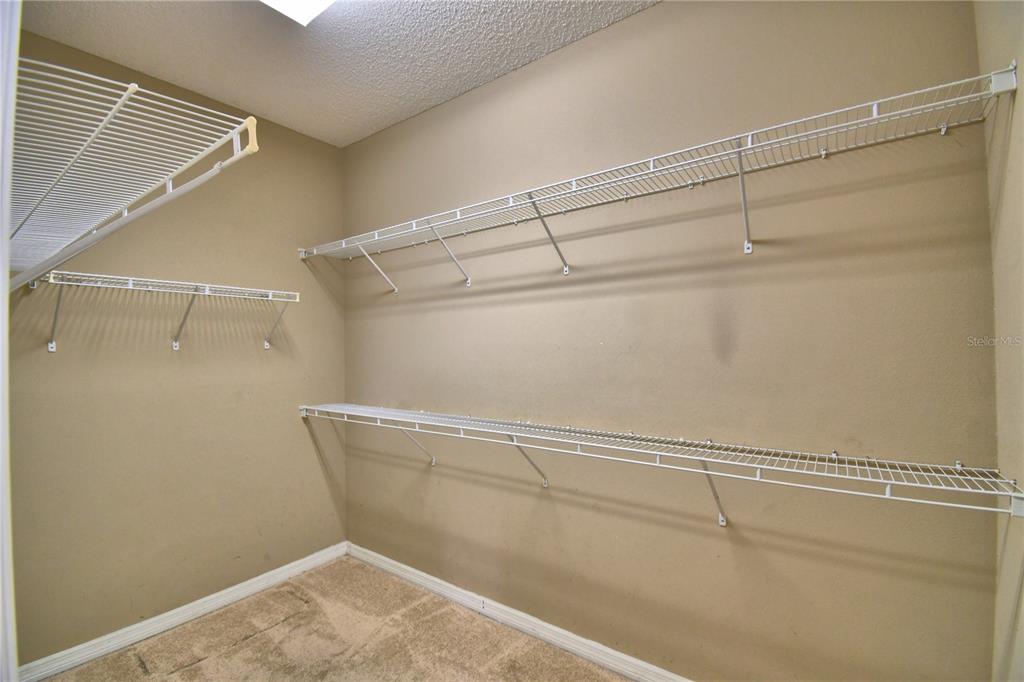 154 Canna Drive Davenport, FL 33897 - Photo 25 of 85 a view of a room with racks on the wall