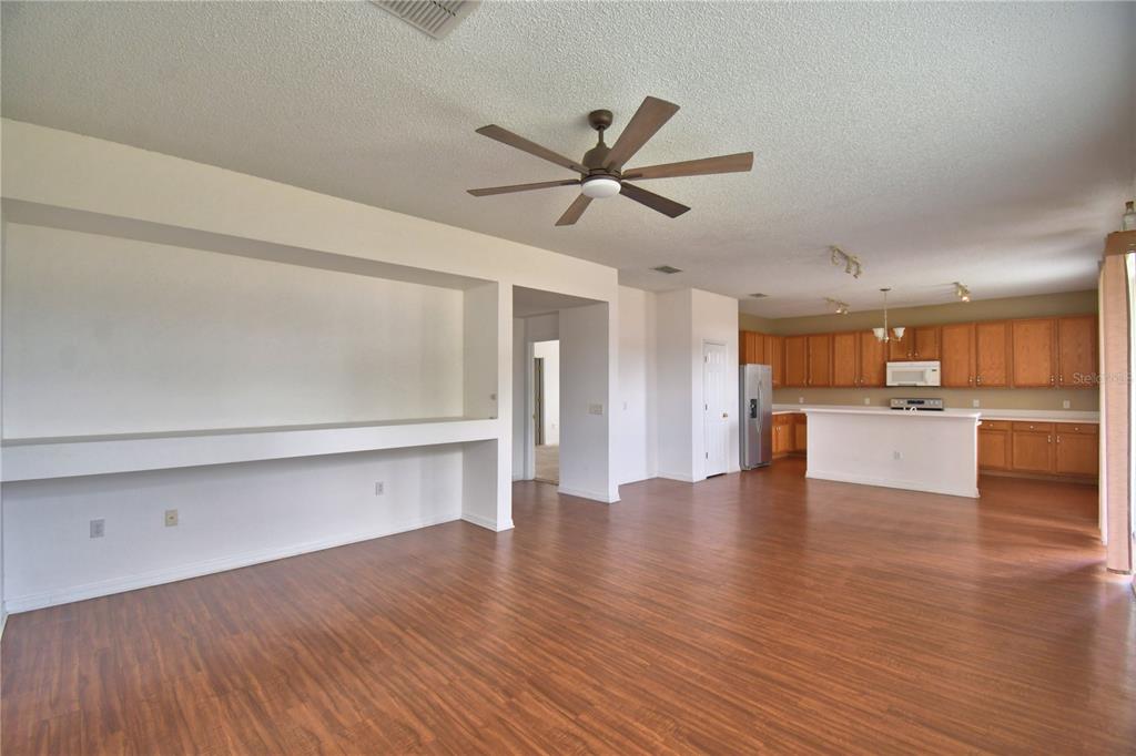 154 Canna Drive Davenport, FL 33897 - Photo 35 of 85 a view of a kitchen with wooden floor and a sink