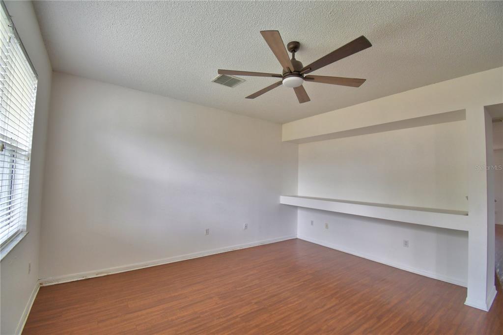 154 Canna Drive Davenport, FL 33897 - Photo 36 of 85 a view of an empty room with a window