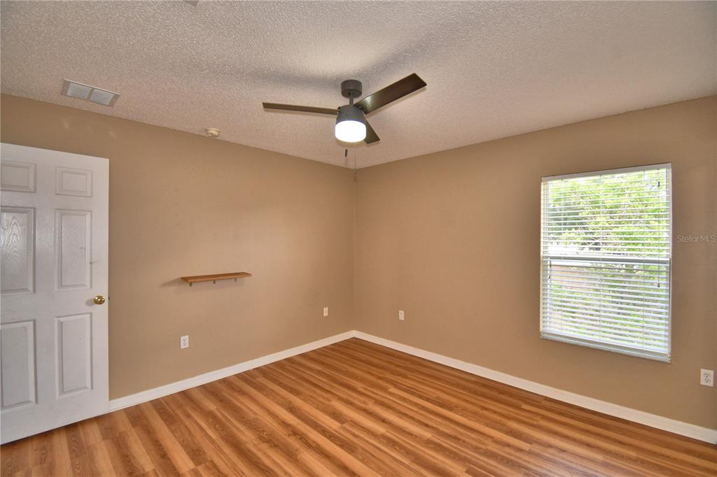 154 Canna Drive Davenport, FL 33897 - Photo 52 of 85 a view of an empty room with a window