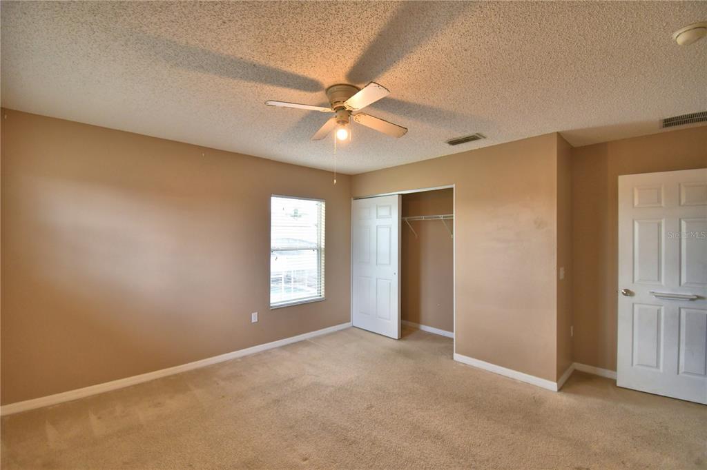 154 Canna Drive Davenport, FL 33897 - Photo 58 of 85 a view of an empty room with a window
