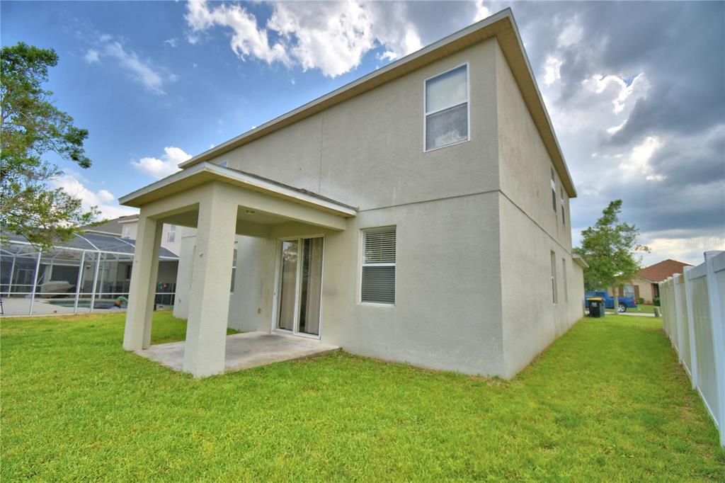 154 Canna Drive Davenport, FL 33897 - Photo 79 of 85 a view of a house with backyard and garden