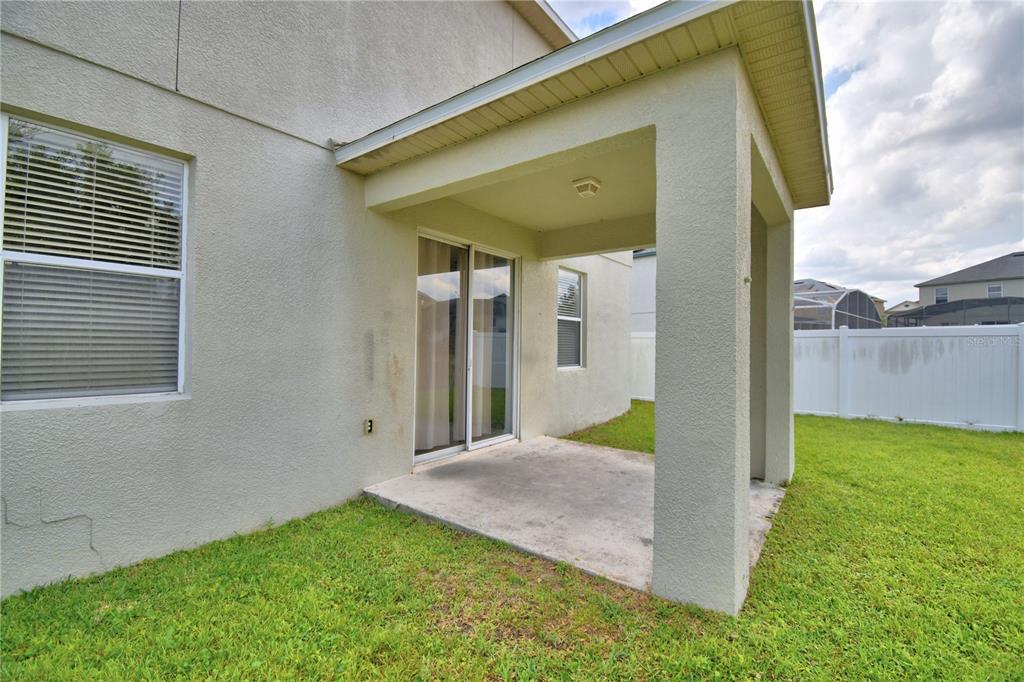 154 Canna Drive Davenport, FL 33897 - Photo 80 of 85 a view of a house with backyard
