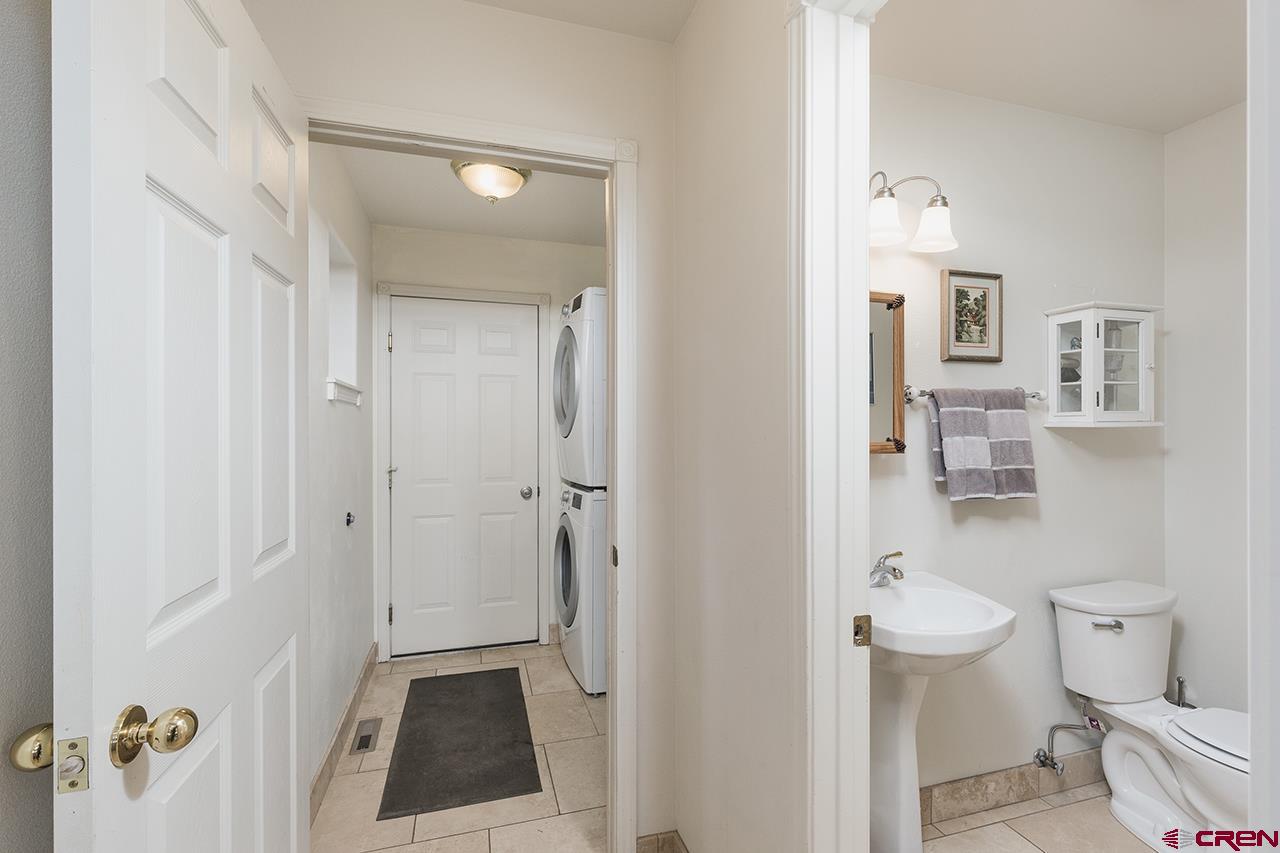 221 Jenkins Ranch Road, Unit H Durango, CO 81301 - Photo 15 of 26 a bathroom with a granite countertop toilet and a shower