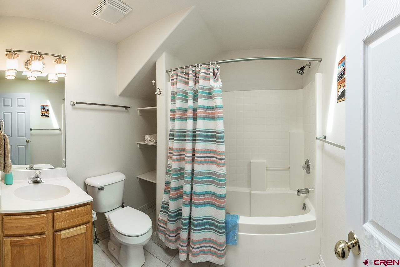 221 Jenkins Ranch Road, Unit H Durango, CO 81301 - Photo 19 of 26 a bathroom with a sink toilet and shower