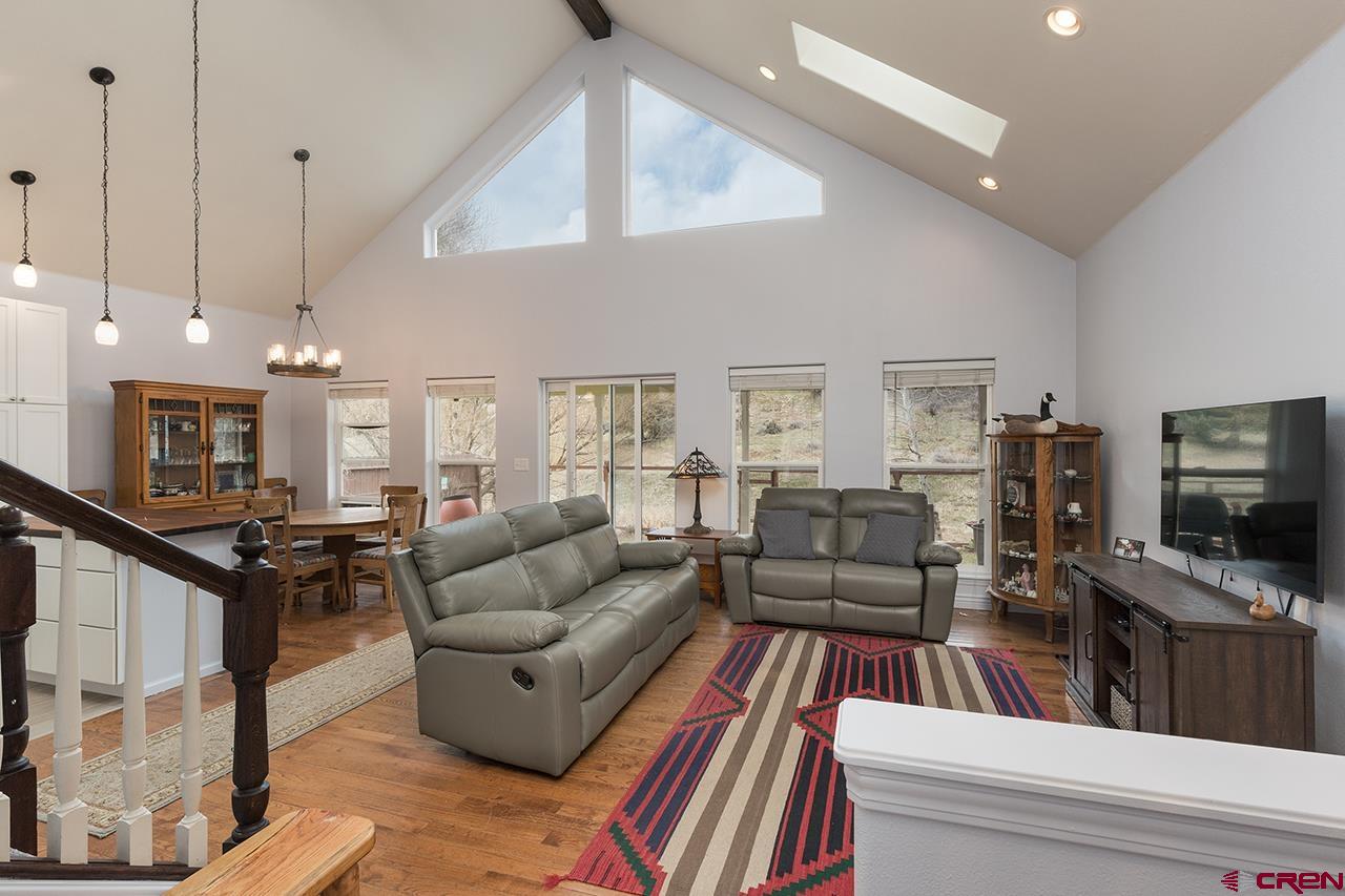 221 Jenkins Ranch Road, Unit H Durango, CO 81301 - Photo 5 of 26 a living room with furniture and a flat screen tv