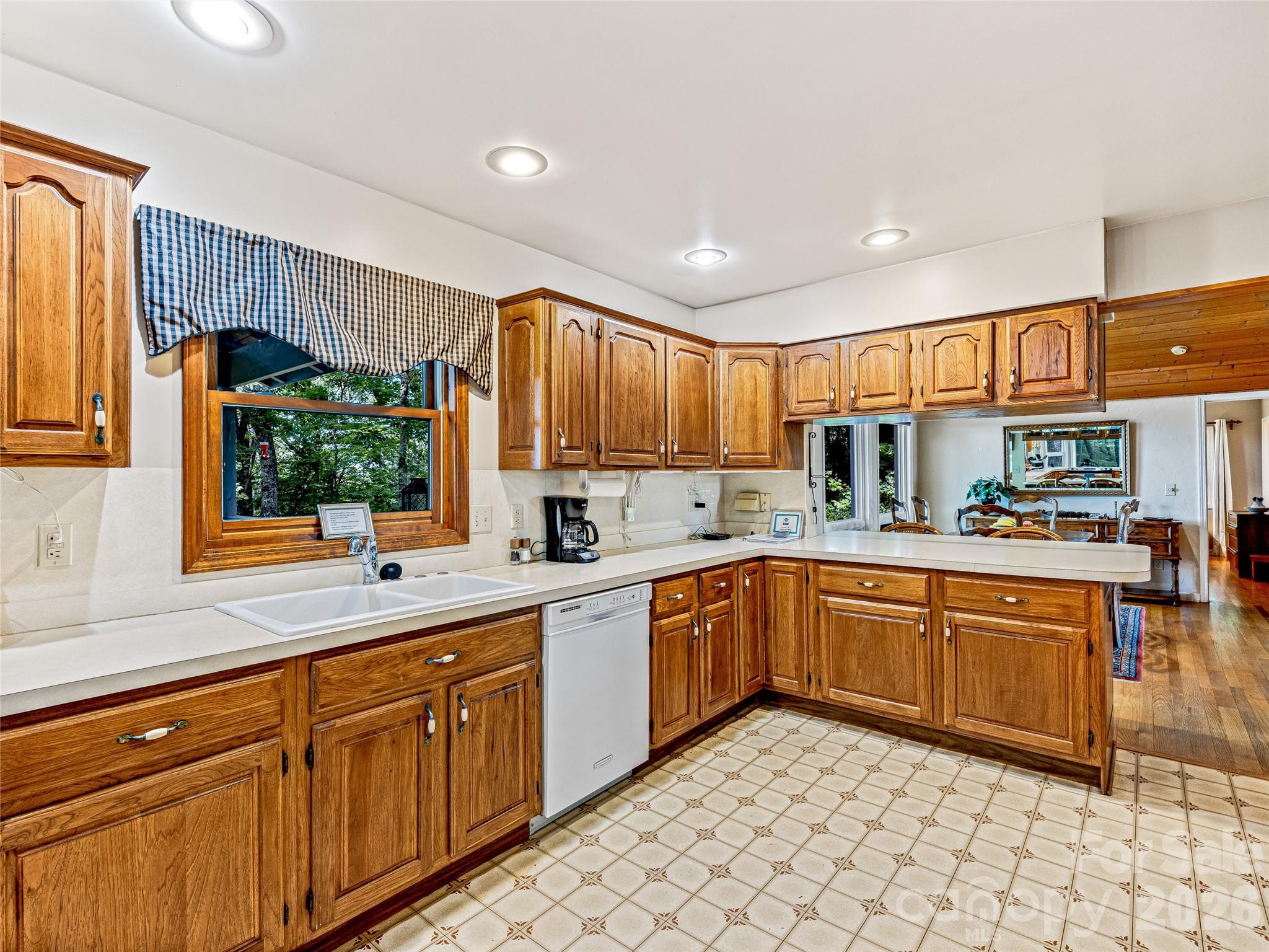 796 Hawk Mountain Road, Unit 36R Lake Toxaway, NC 28747 - Photo 15 of 39 a kitchen with stainless steel appliances granite countertop a sink and cabinets