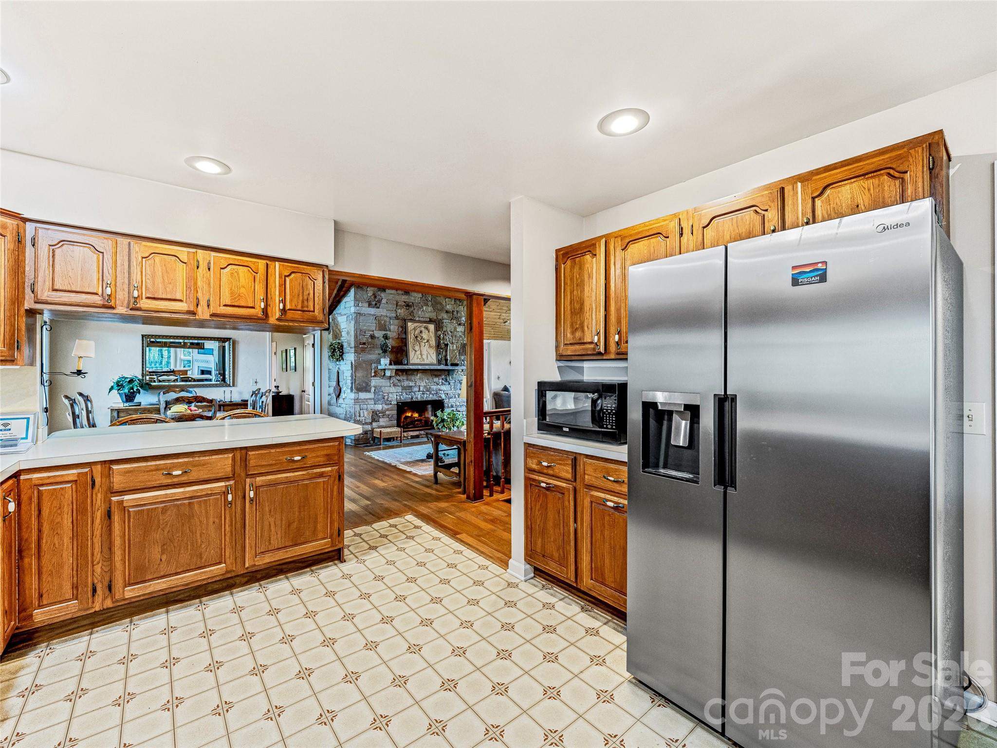 796 Hawk Mountain Road, Unit 36R Lake Toxaway, NC 28747 - Photo 16 of 39 a kitchen with stainless steel appliances granite countertop a refrigerator a oven a sink and dishwasher
