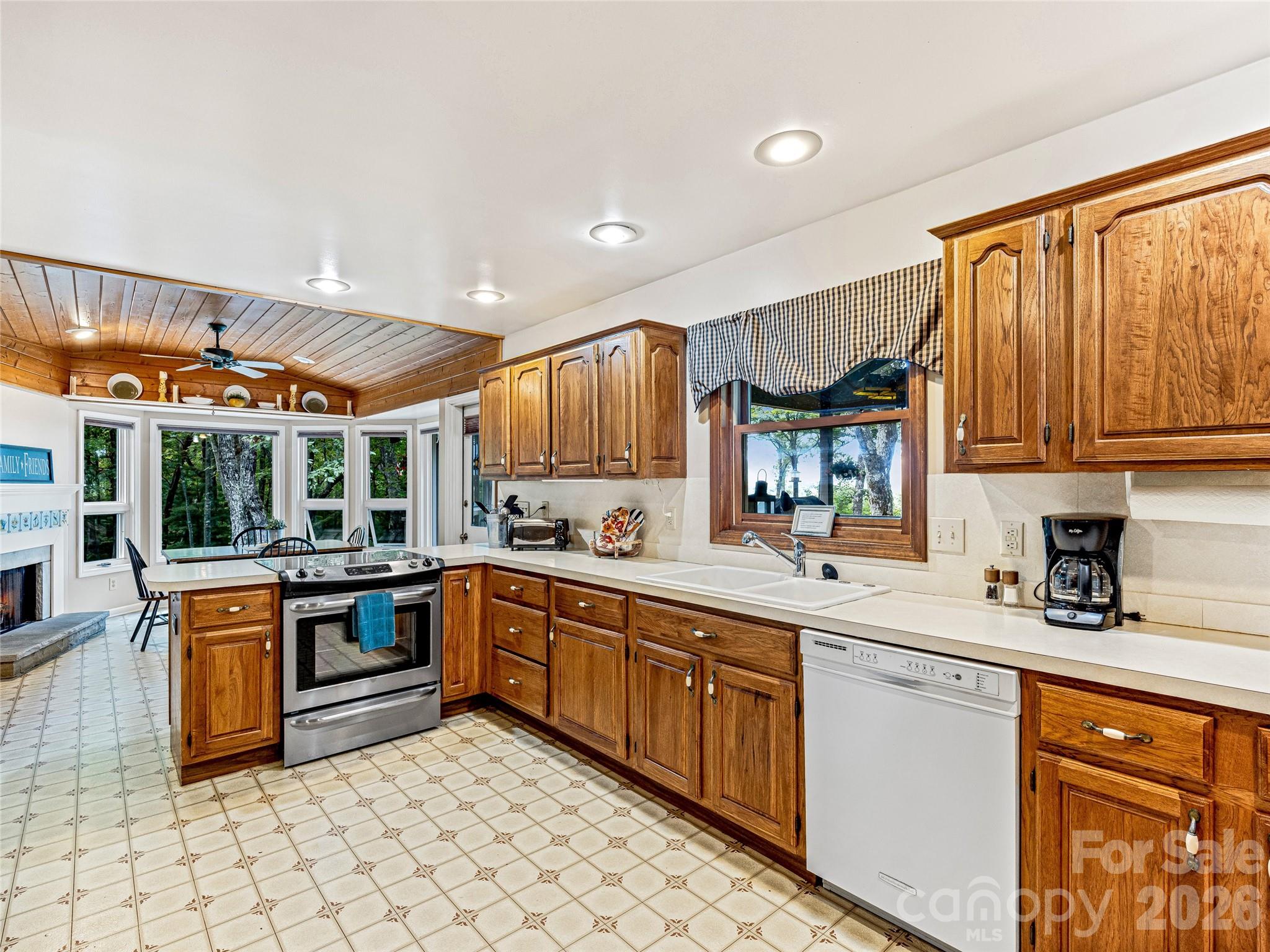 796 Hawk Mountain Road, Unit 36R Lake Toxaway, NC 28747 - Photo 17 of 39 a kitchen with stainless steel appliances granite countertop a sink and cabinets
