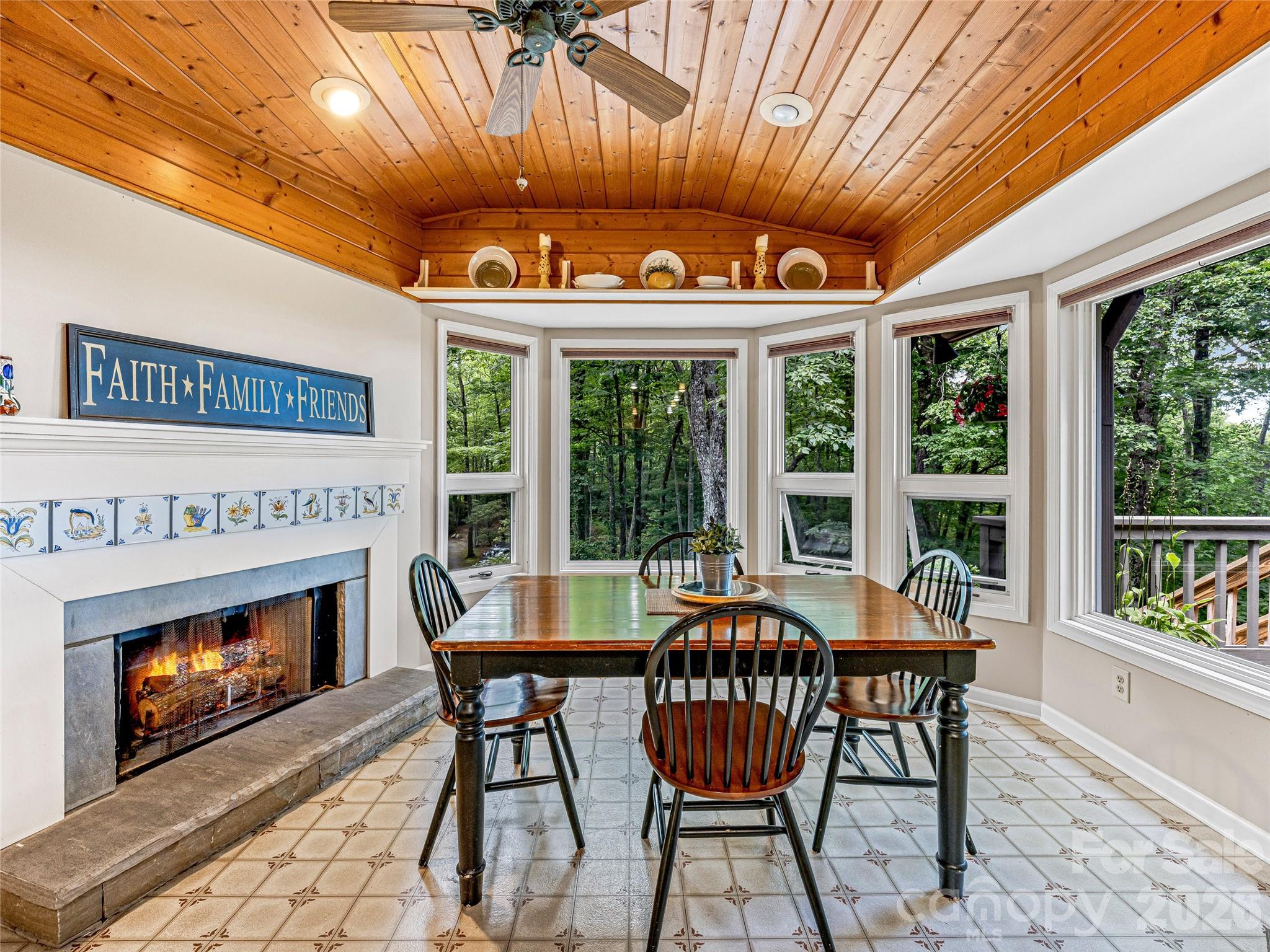 796 Hawk Mountain Road, Unit 36R Lake Toxaway, NC 28747 - Photo 18 of 39 a dining room with furniture a fireplace and large windows