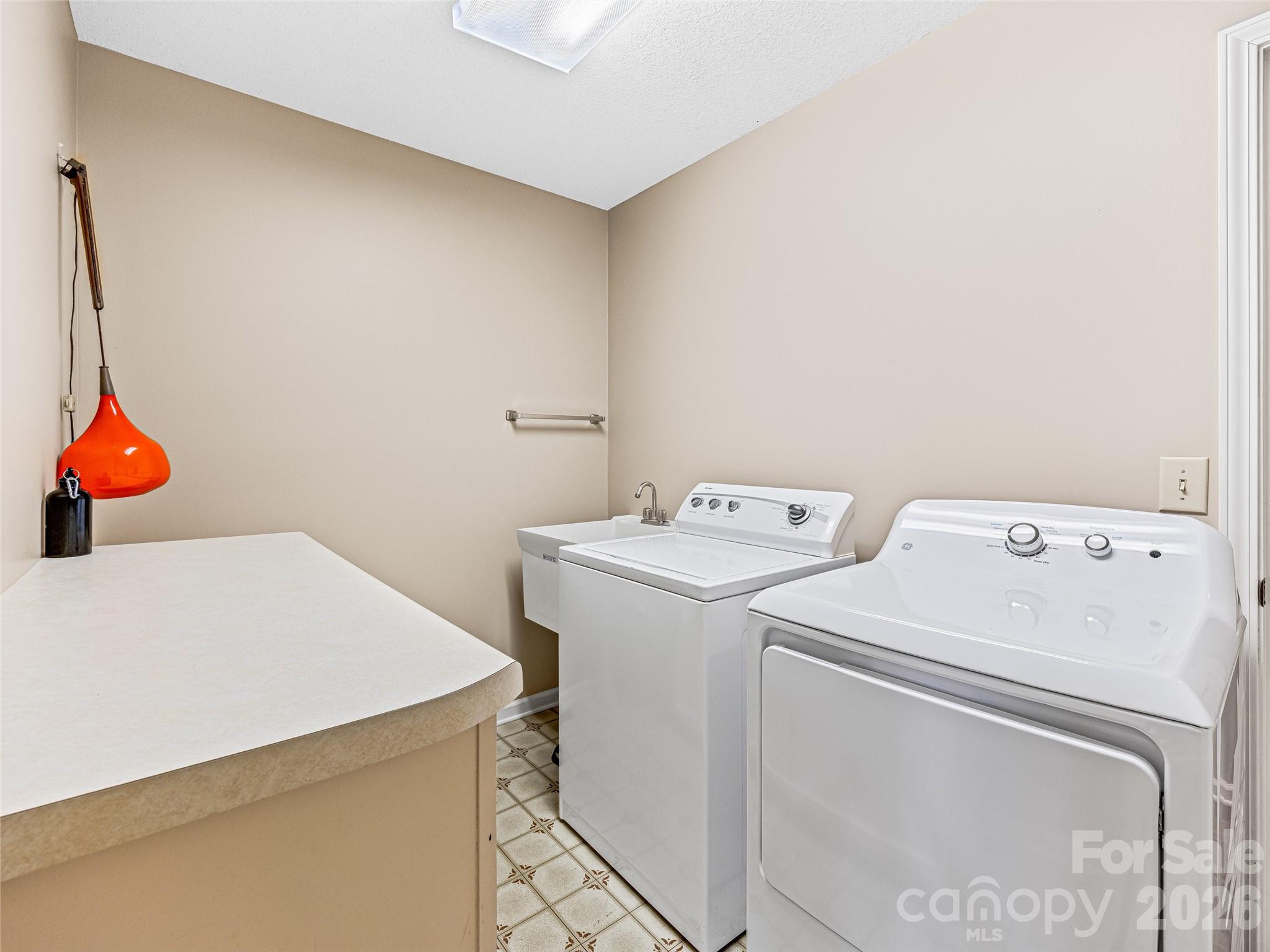 796 Hawk Mountain Road, Unit 36R Lake Toxaway, NC 28747 - Photo 20 of 39 a utility room with dryer and washer