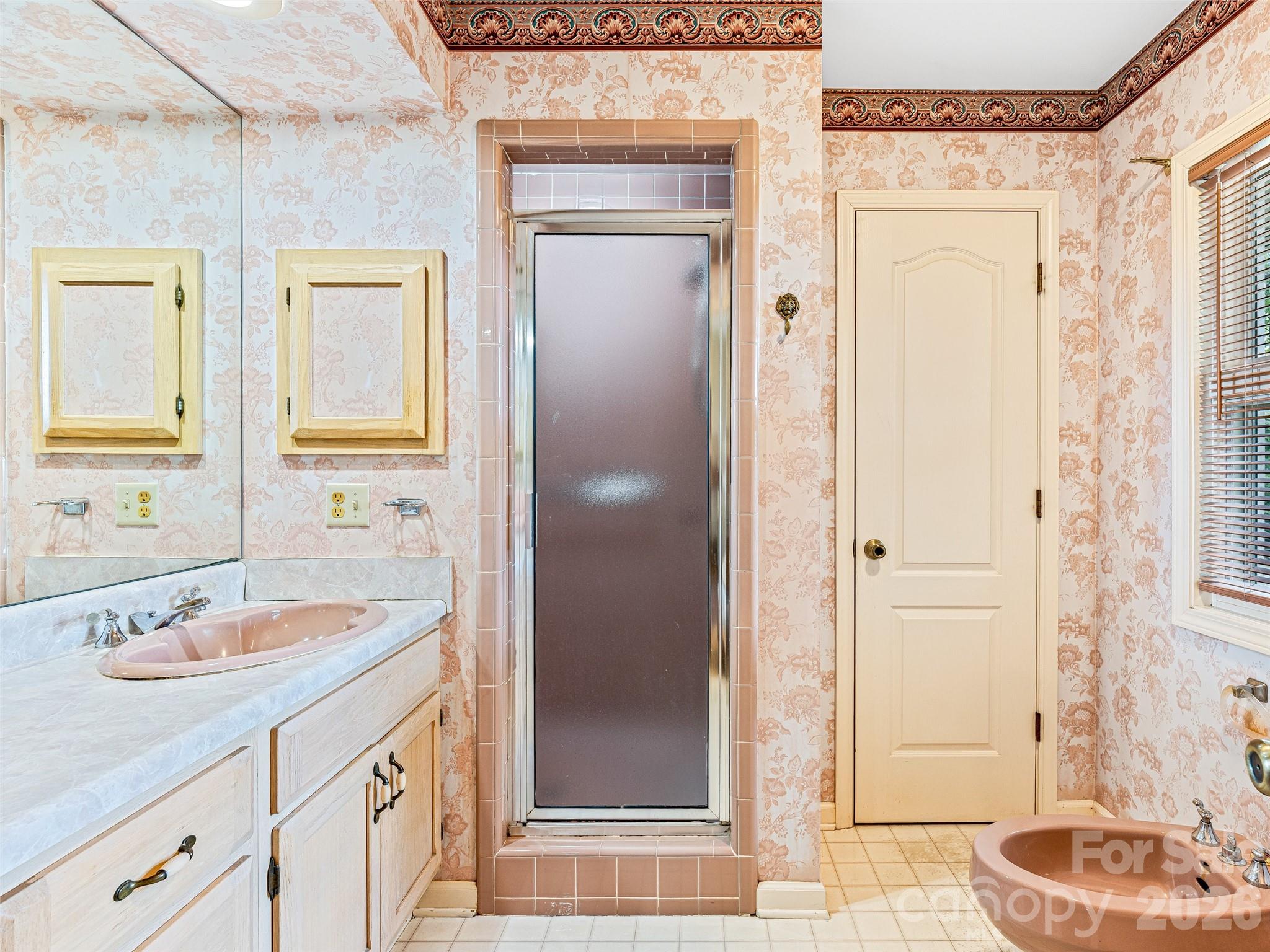 796 Hawk Mountain Road, Unit 36R Lake Toxaway, NC 28747 - Photo 22 of 39 a bathroom with a sink a toilet and a shower