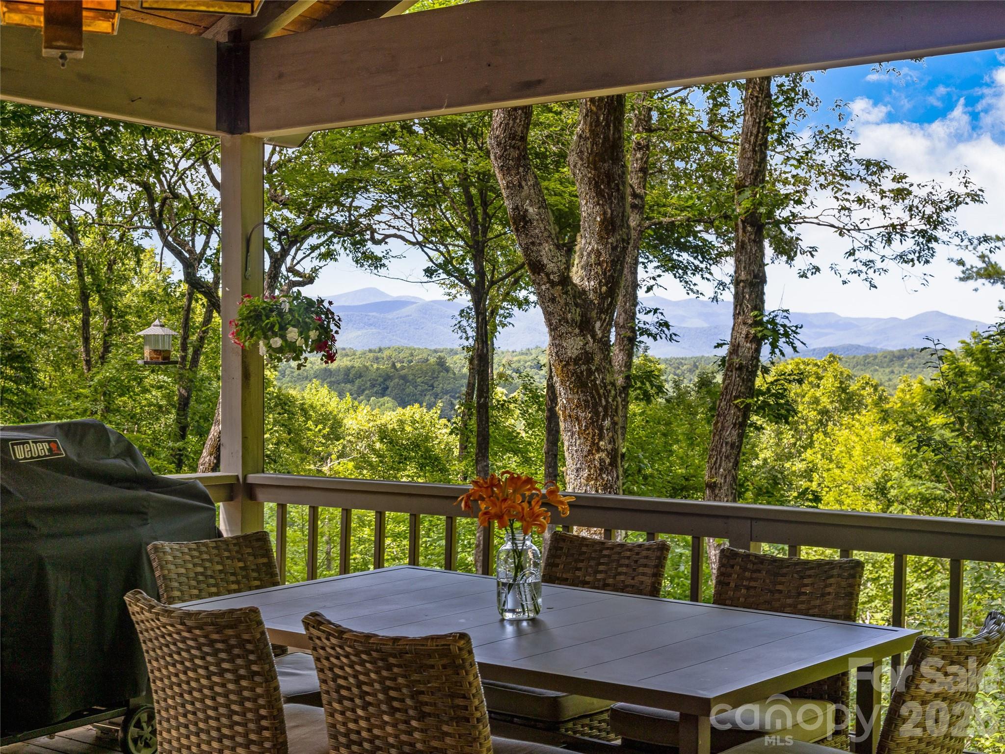796 Hawk Mountain Road, Unit 36R Lake Toxaway, NC 28747 - Photo 31 of 39 a view of a chairs and table in patio