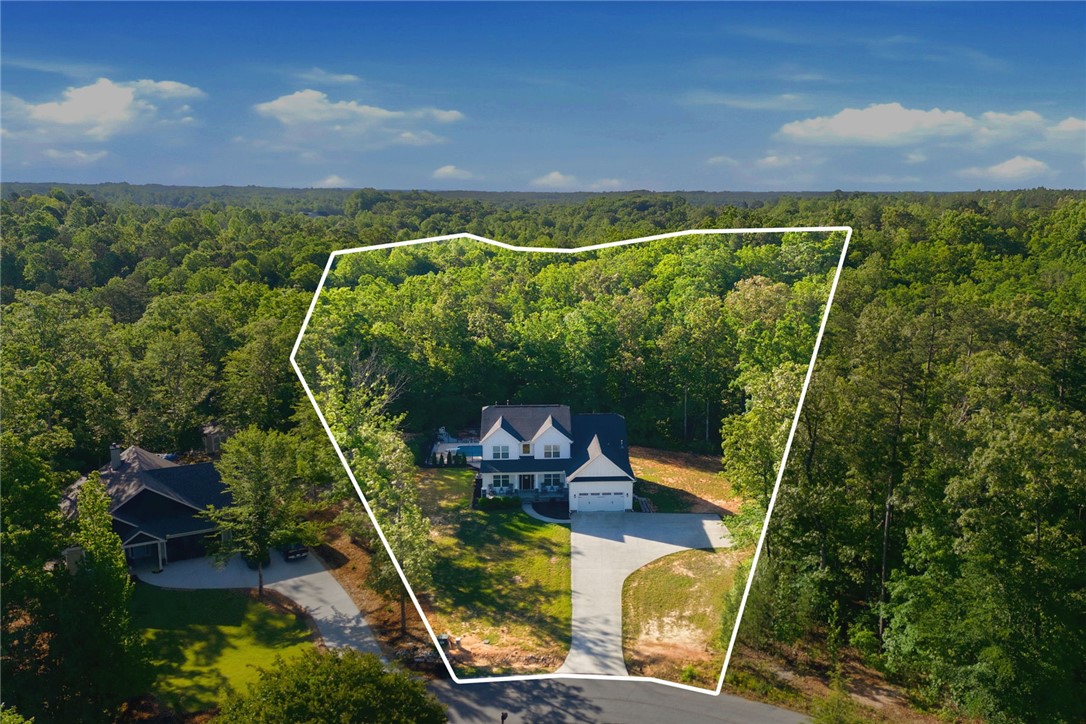 525 16th Circle Walhalla, SC 29691 - Photo 35 of 50 This aerial view showcases a residence nestled within a lush, expansive wooded area.