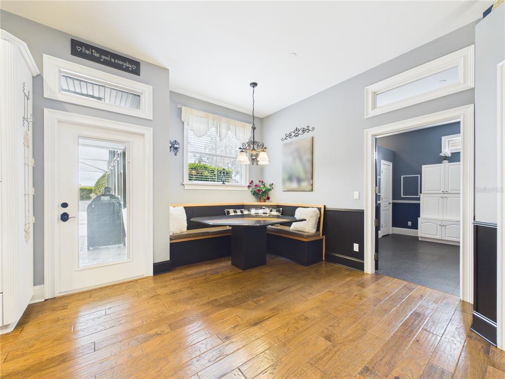 2215 Southwest 80th Street Ocala, FL 34476 - Photo 17 of 64 a large kitchen with kitchen island a counter top space a sink stainless steel appliances and cabinets
