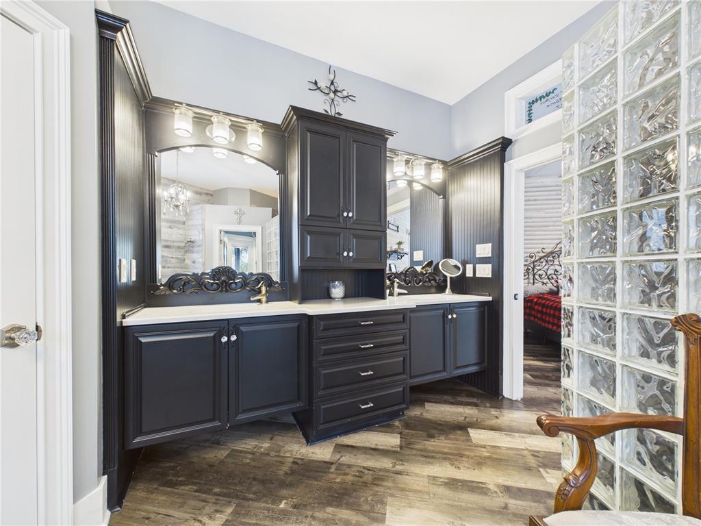 2215 Southwest 80th Street Ocala, FL 34476 - Photo 21 of 64 a spacious bathroom with a double vanity sink and a mirror