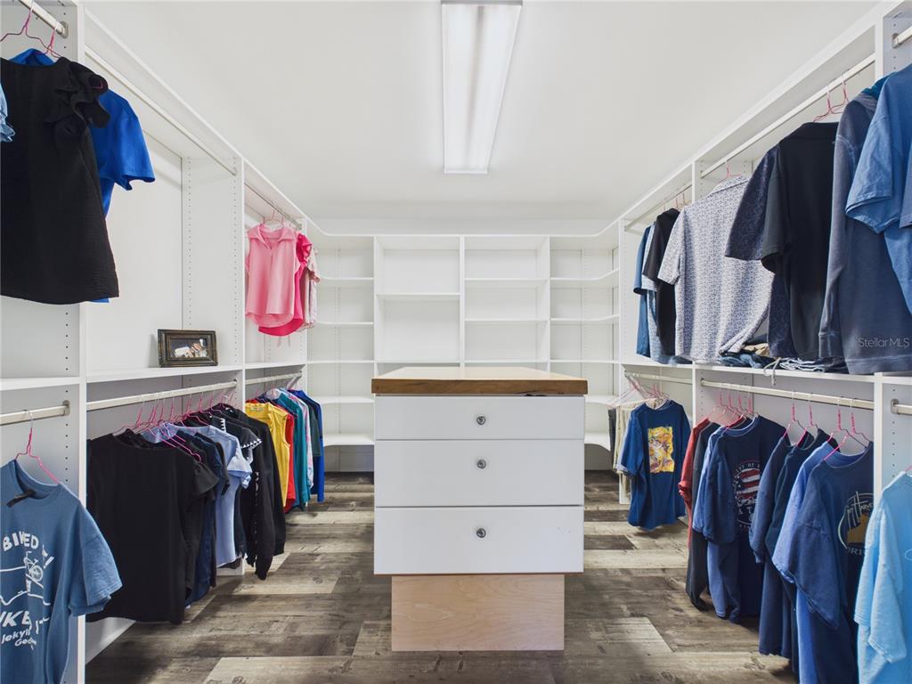 2215 Southwest 80th Street Ocala, FL 34476 - Photo 25 of 64 a view of walk in closet with clothes and shoes