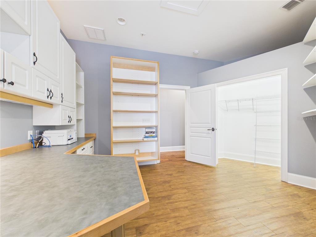 2215 Southwest 80th Street Ocala, FL 34476 - Photo 27 of 64 a large white room with a fireplace and painted walls