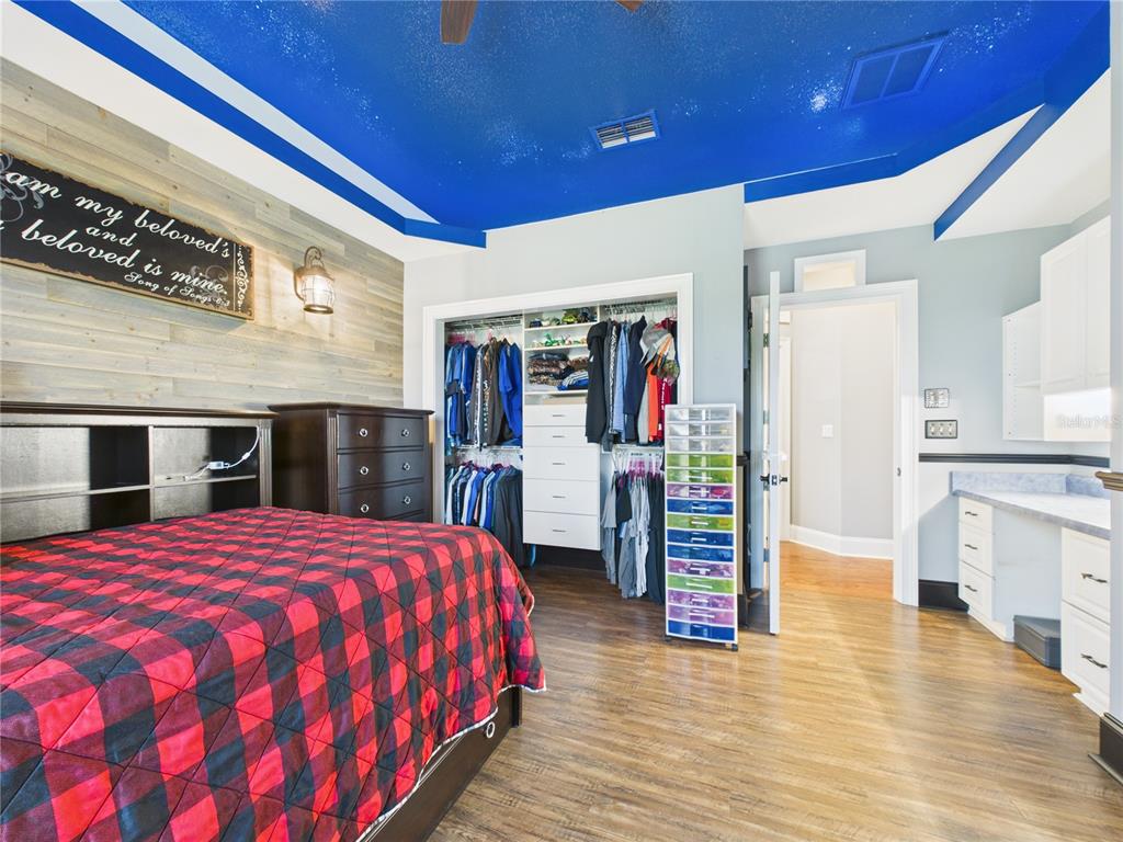 2215 Southwest 80th Street Ocala, FL 34476 - Photo 28 of 64 a bedroom with a bed and a walk in closet