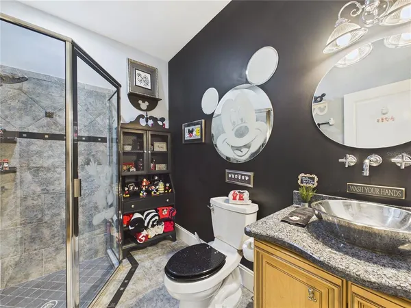 a kitchen with a stove a sink dishwasher and white appliances with wooden cabinets