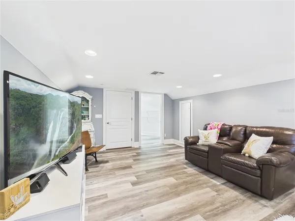 a living room with furniture and a rug