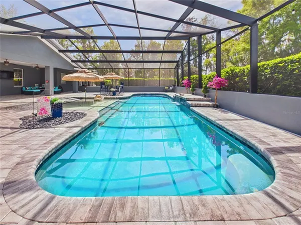 an aerial view of a house with a swimming pool