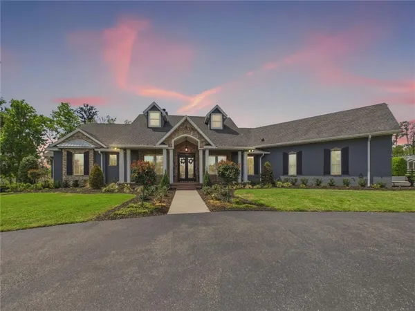 a front view of a house with a yard