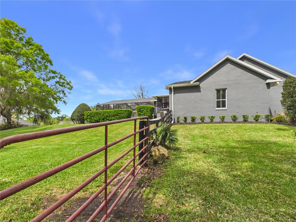 2215 Southwest 80th Street Ocala, FL 34476 - Photo 46 of 64 a view of an house with backyard space and balcony