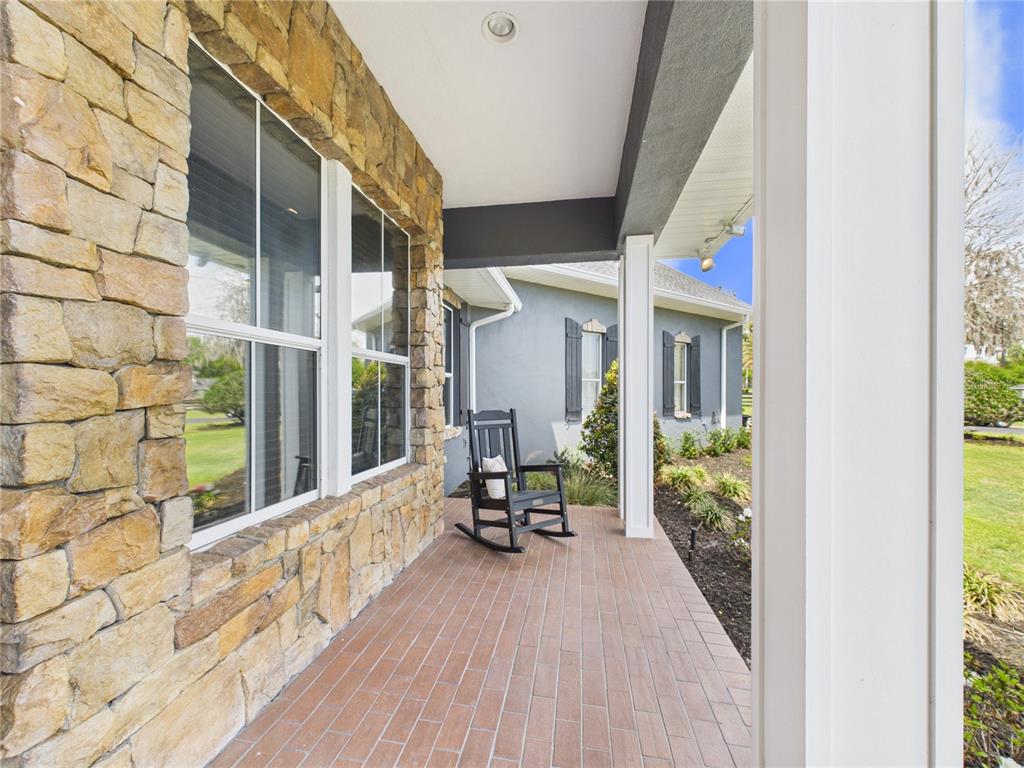 2215 Southwest 80th Street Ocala, FL 34476 - Photo 5 of 64 a view of a chair and table in a balcony