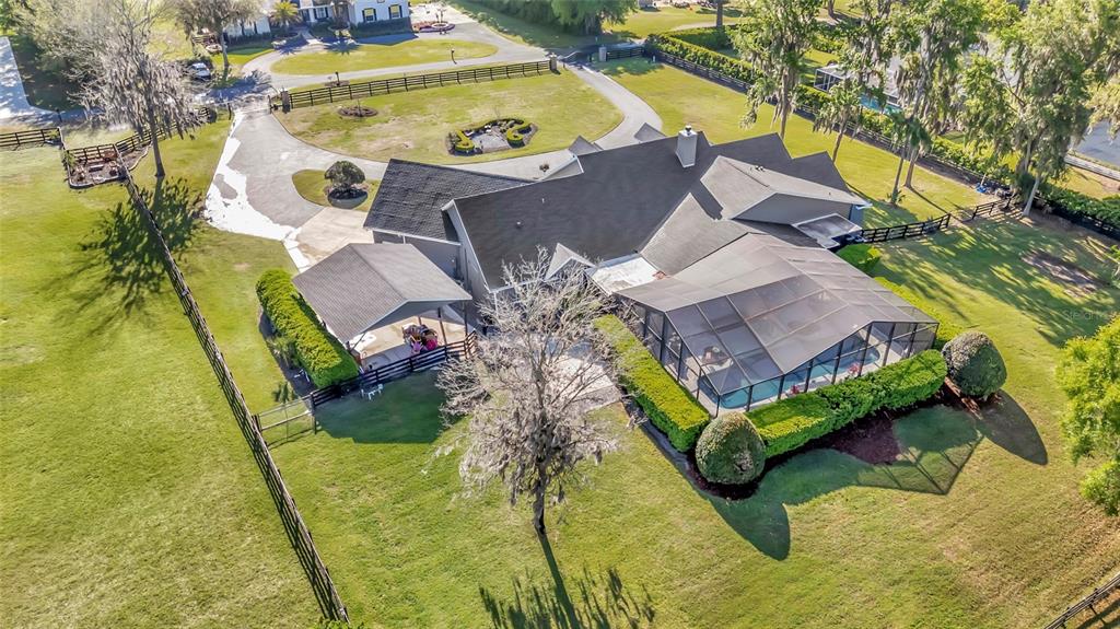 2215 Southwest 80th Street Ocala, FL 34476 - Photo 60 of 64 an aerial view of a house with swimming pool
