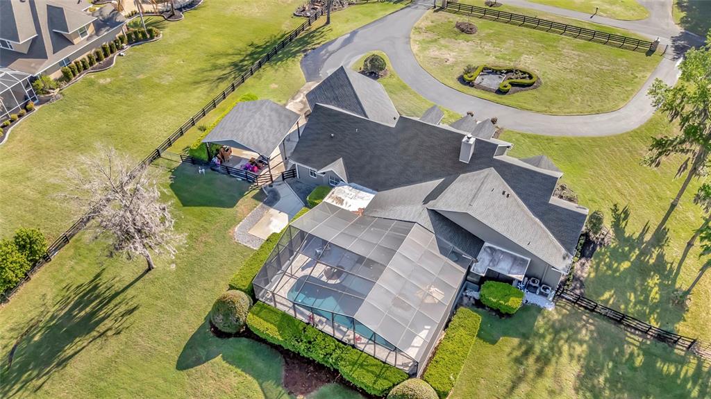 2215 Southwest 80th Street Ocala, FL 34476 - Photo 61 of 64 an aerial view of a house with a swimming pool
