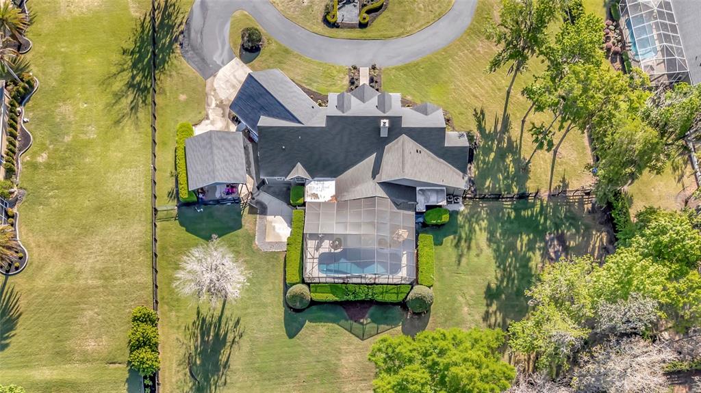 2215 Southwest 80th Street Ocala, FL 34476 - Photo 62 of 64 a aerial view of a house with swimming pool garden and patio