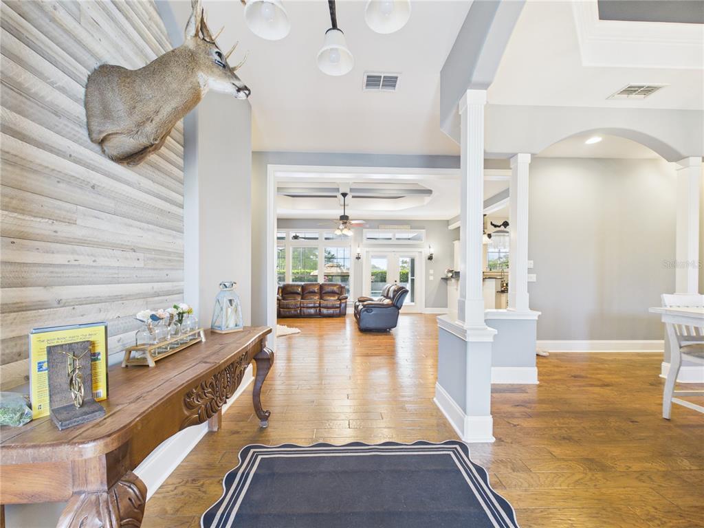 2215 Southwest 80th Street Ocala, FL 34476 - Photo 7 of 64 a lobby with furniture and floor to ceiling window