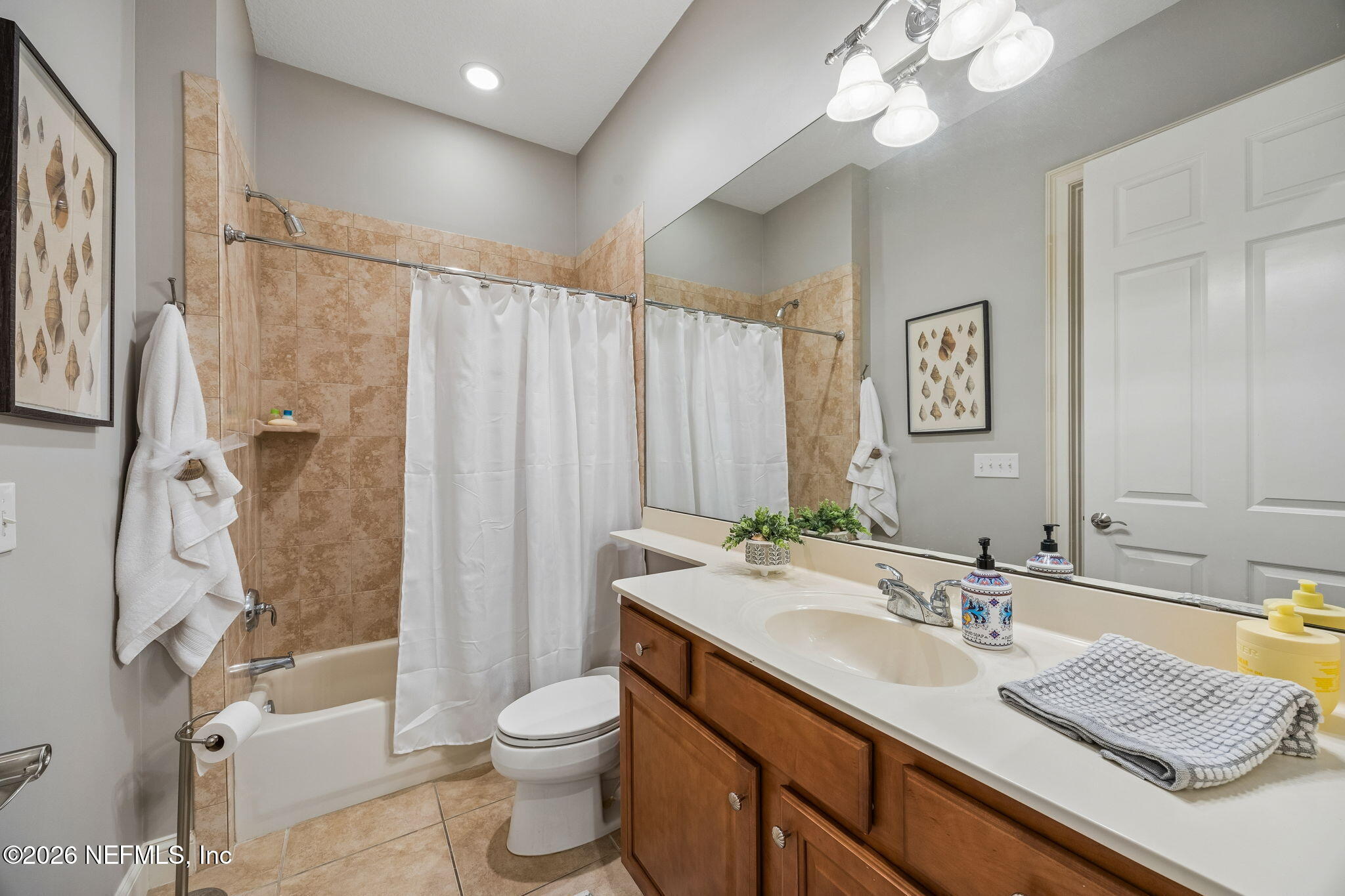 96122 Roddenberry Way Fernandina Beach, FL 32034 - Photo 7 of 39 a bathroom with a granite countertop sink toilet and shower